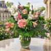 Pink and white mixed bouquet in a clear glass vase