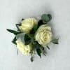 Small bouquet of cream roses with greenery and ribbon