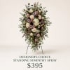 Standing sympathy spray with roses, hydrangea, and mixed greenery on an easel