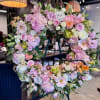 Honor the memory of a loved one with our Standing Floral Wreath