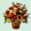 A happy jack-o-lantern is host to faux candy corn and long-lasting fall