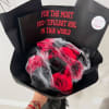 Black-wrapped bouquet of red roses with faux spiderwebs and plastic spiders