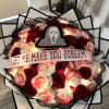 Horror has never been this romantic. This spooky bouquet features red and