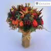 Bouquet of orange and red flowers wrapped in burlap
