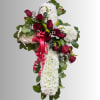 Cross-shaped floral spray with red roses and white chrysanthemums