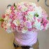 Pink and white rose bouquet in a pale pink hat box