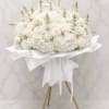 A serene all-white standing bouquet that makes a quiet, elegant statement for