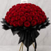 A dramatic cloud of 150 deep red roses creates an unmistakable statement-this