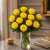 Yellow roses arranged in a clear glass vase