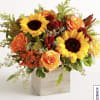Sunflower and orange rose arrangement in a wooden cube vase