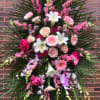 Large pink and white floral standing spray with lilies and roses