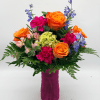 Bright color pops make this mixed-color flower arrangement an instant mood lifter