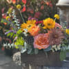 A vibrant rustic arrangement to usher in the changing of the leaves