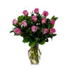 Arrangement of pink roses in a clear glass vase with visible stems