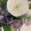 Bouquet with white and lavender flowers and green foliage