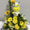 This full, layered design pairs bold yellow sunflowers and roses with white