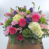 Elevate your space with our modern floral arrangement in a brown 7x7"