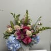 A lively, romantic flower arrangement that feels like a joyful celebration in