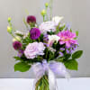 Celebrate the beauty of the season with this charming arrangement featuring a