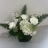 A lush and elegant arrangement designed to evoke the beauty of a