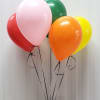 Cluster of colorful balloons against a plain wall
