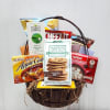 Gift basket filled with snack boxes and tea packets