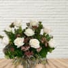 White rose bouquet with pink filler flowers and greenery