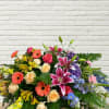 Colorful mixed flower arrangement with roses, lilies, and gerbera daisies