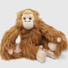 Plush orangutan toy sitting on a white background