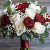Bouquet of red and white roses with baby's breath and eucalyptus