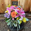 Bouquet of pink lilies and orange roses with purple flowers