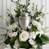 White floral funeral urn arrangement with roses and lilies