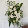 Tall white floral standing arrangement with lilies and roses