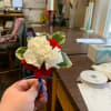 Red and white carnations, green Pitt and royal blue ribbon, make this