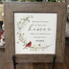Framed memorial sign with a red cardinal and floral illustration