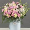 Pink and white mixed bouquet in a white hatbox