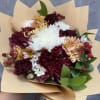 A rich and cheerful mix of burgundy chrysanthemums, white mums, peach daisies