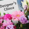 Pink and lavender mixed bouquet with a designer's choice sign