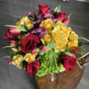 Bouquet of red and yellow roses with pink tulips and purple flowers