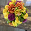 Bouquet of yellow roses, orange tulips, and purple mums