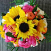 Bright bouquet with sunflowers, pink blooms, and orange flowers