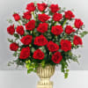 Red roses arranged in a decorative urn vase