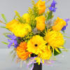 Bright yellow and purple mixed bouquet in a black vase