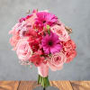 Pink bouquet of roses, gerbera daisies, and carnations on a stand