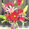 A bold little day‑brightener with a sweet streak.

This vibrant arrangement blends the