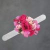 Clustered pink roses-from hot pink to soft blush-sit snugly on a silver