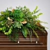 Graceful Comfort embraces the peacefulness of a farewell with a woodland-inspired casket