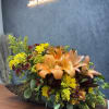 Introducing our Cornucopia of Fall&mdash;a stunning arrangement featuring vibrant orange lilies, daisies