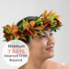 Floral crown of orange, red, and green flowers worn on a woman's head