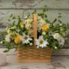 Basket arrangement with white daisies and yellow roses